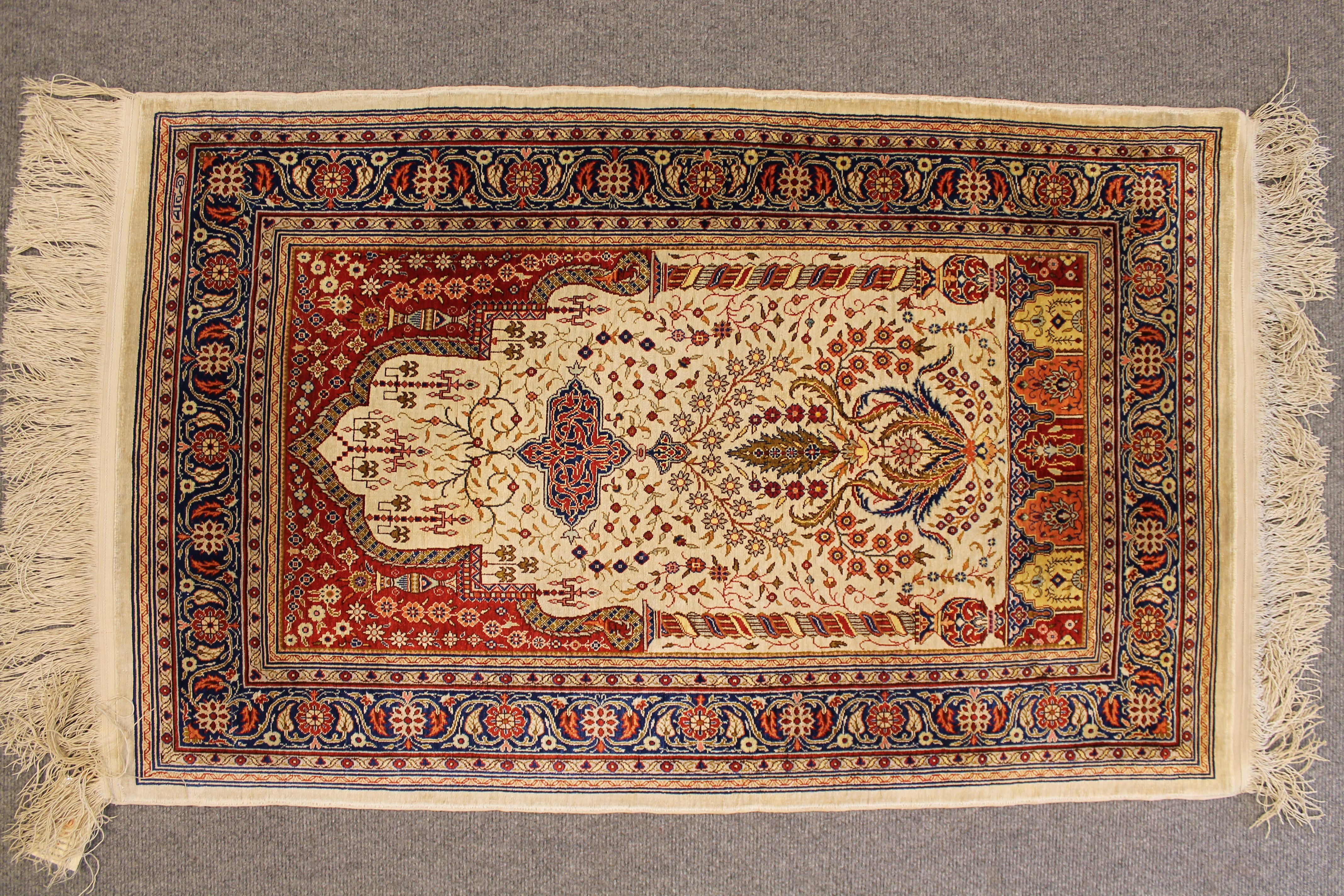 Antique silk Hereke rug