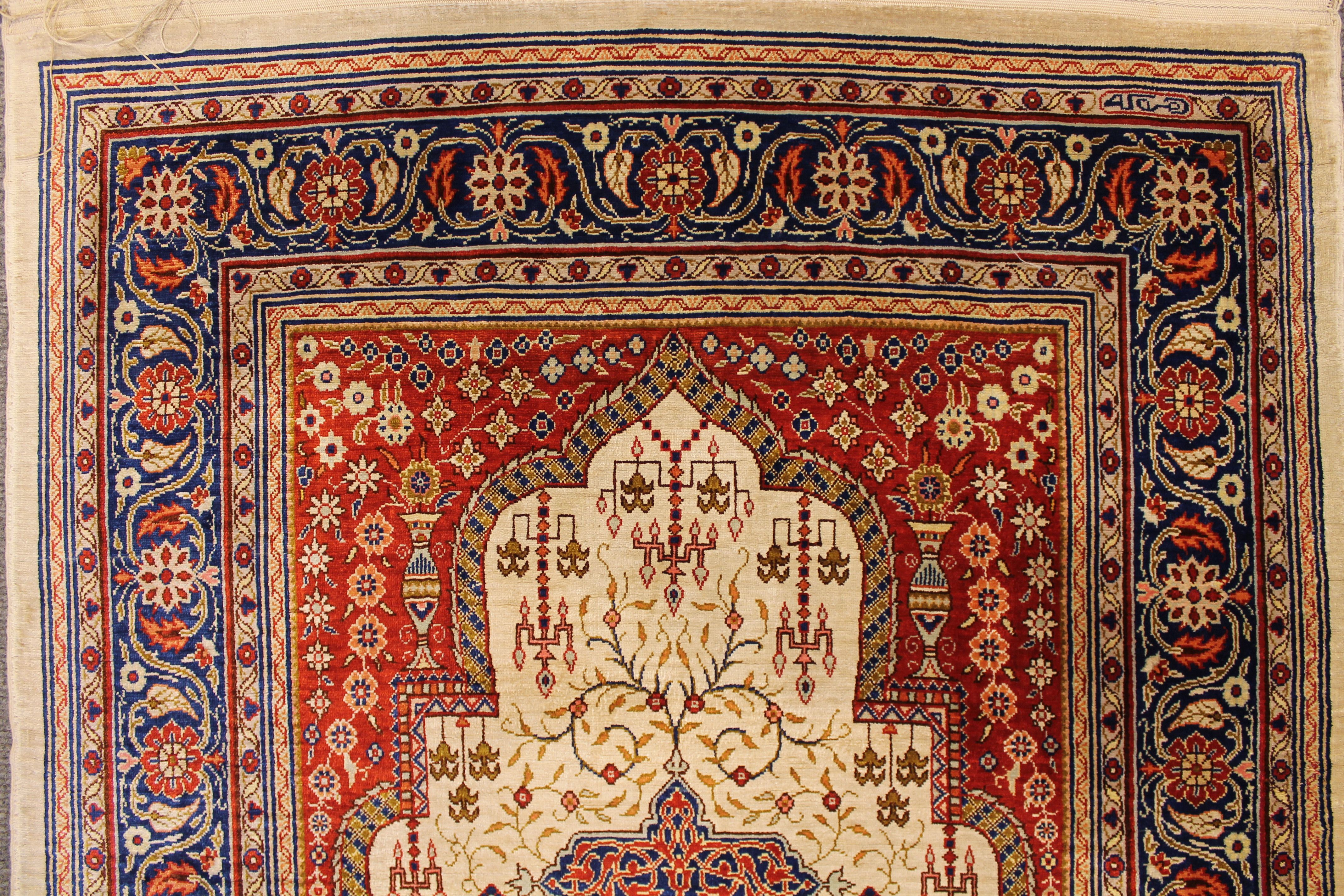 Antique silk Hereke rug