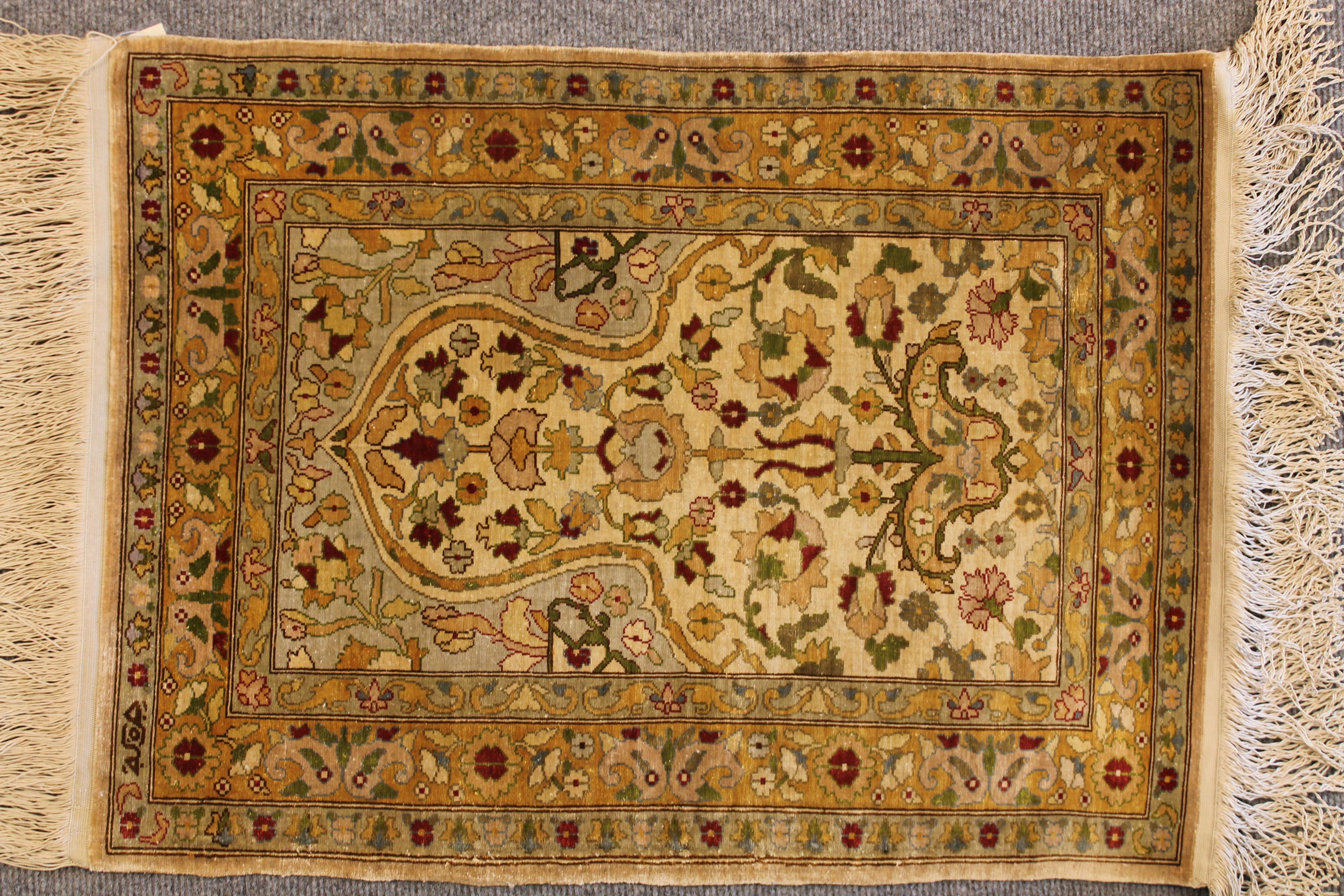 Antique Silk Hereke rug