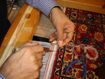 Anas restoring a rug at The Oriental Rug Gallery Ltd, Haslemere (1).jpg