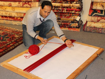 Anas weaving the St George Flag design 2012.jpg
