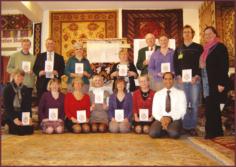 Haslemere Museum weave their rug knots for Haslemere In Stitches at The Oriental Rug Gallery.jpg